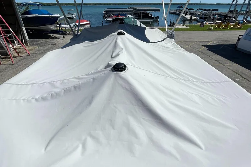 Slide: The Image of 2023 Berkshire 24 UL CTS boat covered at a marina dock. - 31