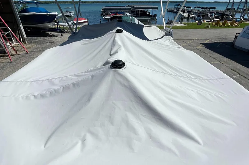 Slide: The Image of 2023 Berkshire 24 UL CTS boat covered at a marina. - 32