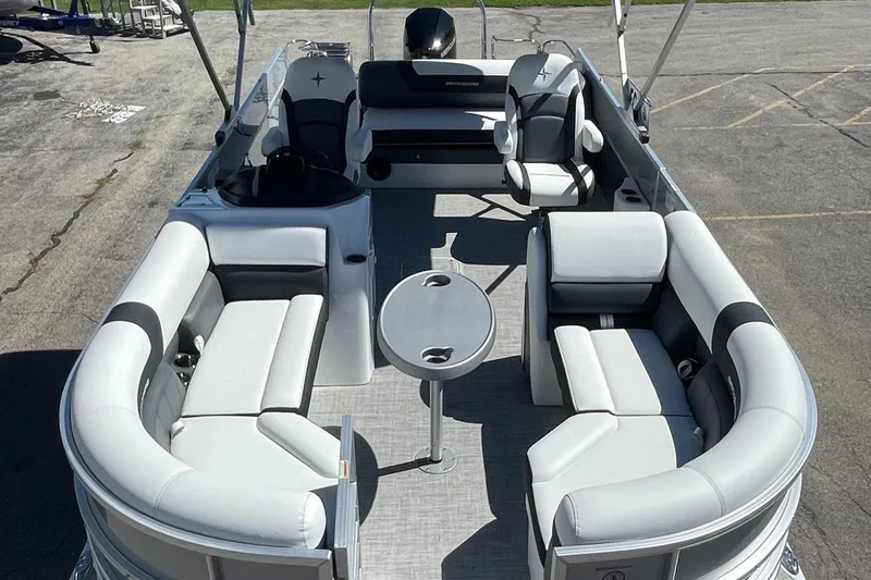 Slide: The Image of 2023 Berkshire 24 UL CTS pontoon boat with spacious seating and table. - 9