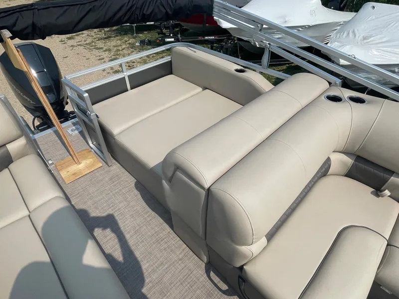 Slide: The Image of 2024 Sun Tracker Party Barge 22 RF XP3 with beige seating and spacious deck. - 14