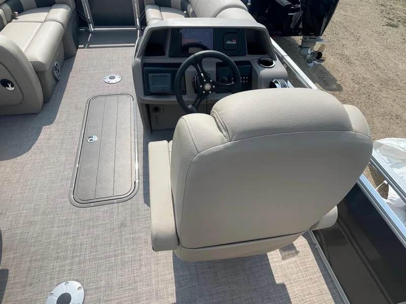 Slide: The Image of 2024 Sun Tracker Party Barge 22 RF XP3 helm and seating area. - 16