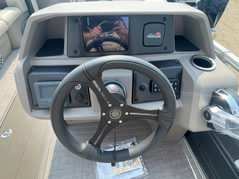 Slide: The Image of Steering console of 2024 Sun Tracker Party Barge 22 RF XP3 pontoon boat. - 17