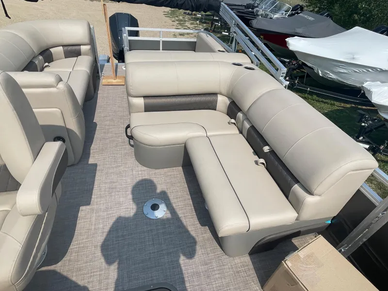 Slide: The Image of 2024 Sun Tracker Party Barge 22 RF XP3 interior seating area with beige upholstery. - 6