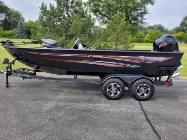 Slide: The Image of 2023 Ranger VS1882SC Reata fishing boat on a trailer in a park. - 0