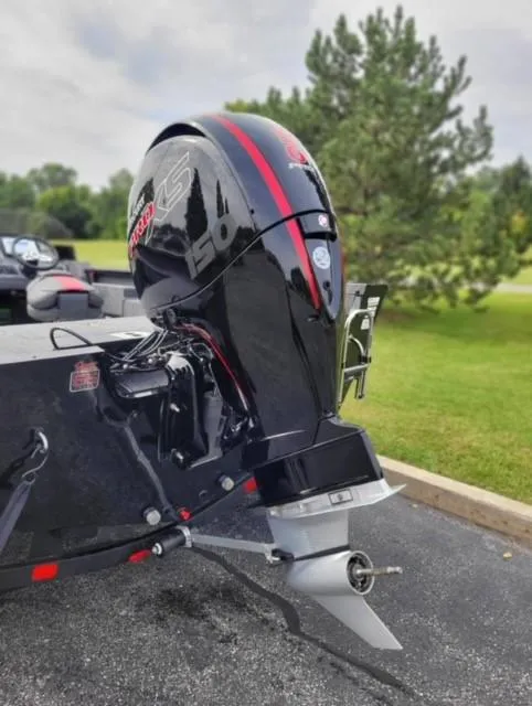 Slide: The Image of 2023 Ranger VS1882SC Reata boat with a powerful outboard motor. - 2