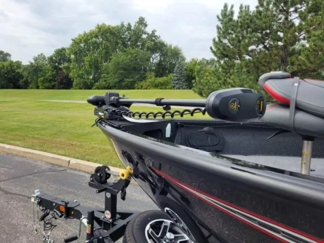 Slide: The Image of 2023 Ranger VS1882SC Reata boat on trailer in a park setting. - 6