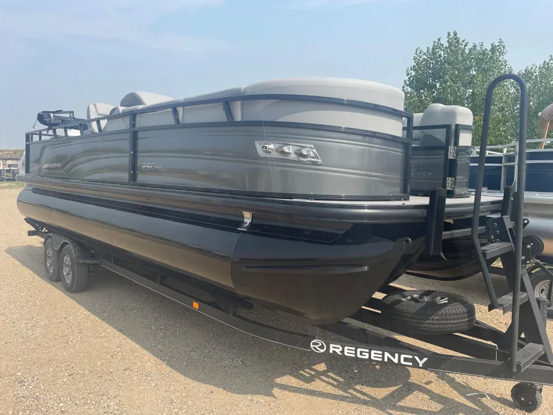 Slide: The Image of 2024 Regency 250 DL3 pontoon boat on trailer. - 1