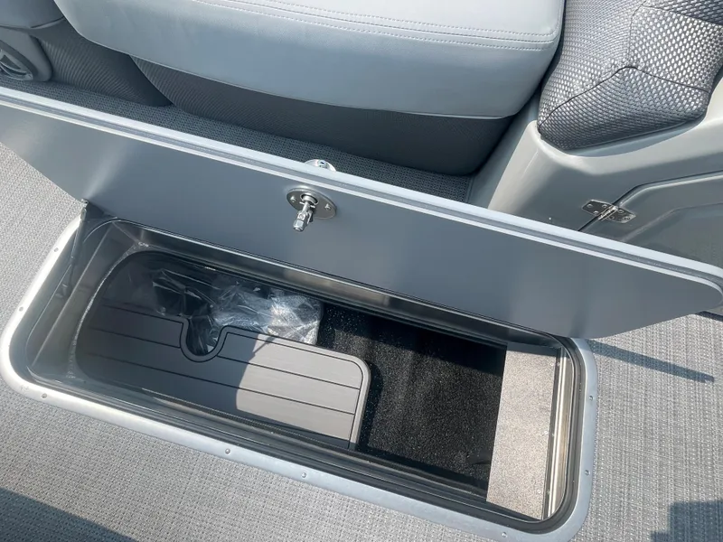 Slide: The Image of Open storage compartment in 2024 Regency 250 DL3 boat. - 22