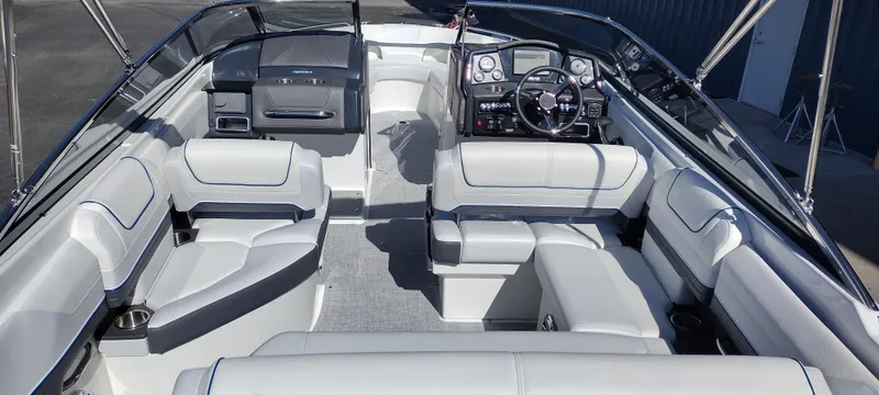 Slide: The Image of 2024 Formula 240 BR boat interior with luxurious seating and modern dashboard. - 13