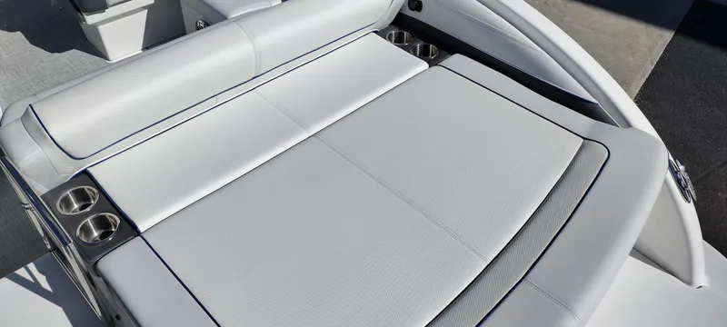 Slide: The Image of 2024 Formula 240 BR boat with white cushioned seating and cup holders. - 14