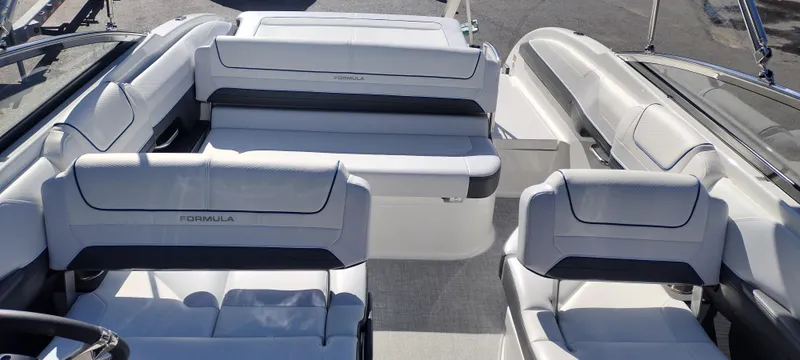 Slide: The Image of 2024 Formula 240 BR boat interior with white and gray seating. - 19