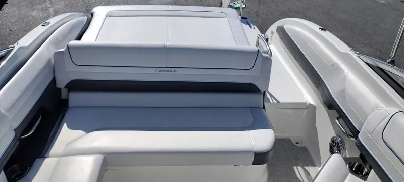 Slide: The Image of 2024 Formula 240 BR boat interior with white seating and sun pad. - 22