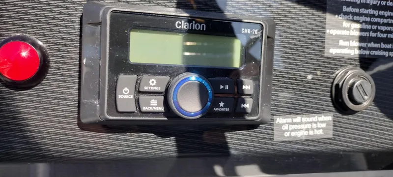 Slide: The Image of Clarion audio system on 2024 Formula 240 BR boat dashboard. - 33