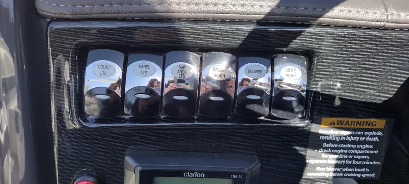 Slide: The Image of Control panel of a 2024 Formula 240 BR boat with labeled switches. - 34