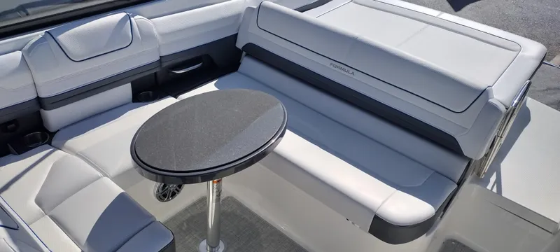 Slide: The Image of 2024 Formula 240 BR boat interior with seating and table. - 39