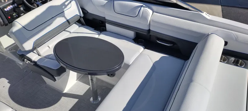 Slide: The Image of 2024 Formula 240 BR boat interior with white seating and a black table. - 40