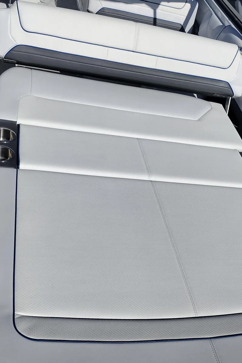 Slide: The Image of 2024 Formula 240 BR boat interior with white cushioned seating. - 44