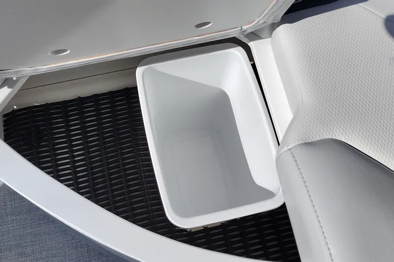 Slide: The Image of 2024 Formula 240 BR boat storage compartment with white bin. - 45