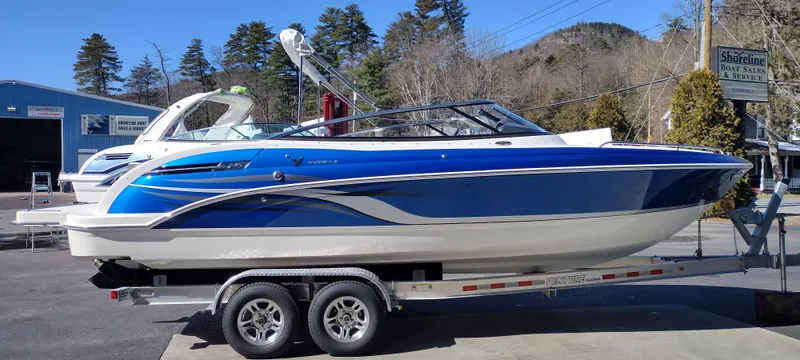 Slide: The Image of 2024 Formula 240 BR boat on a trailer in a marina. - 5