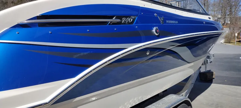 Slide: The Image of 2024 Formula 240 BR boat with blue and white exterior design. - 6