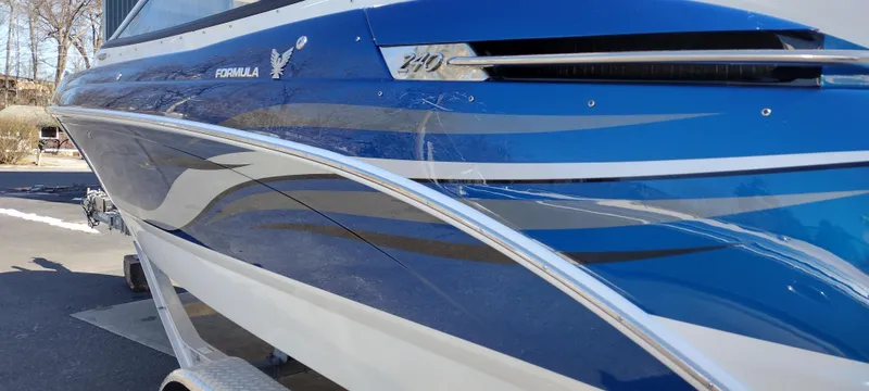 Slide: The Image of 2024 Formula 240 BR boat with sleek blue and white design. - 9
