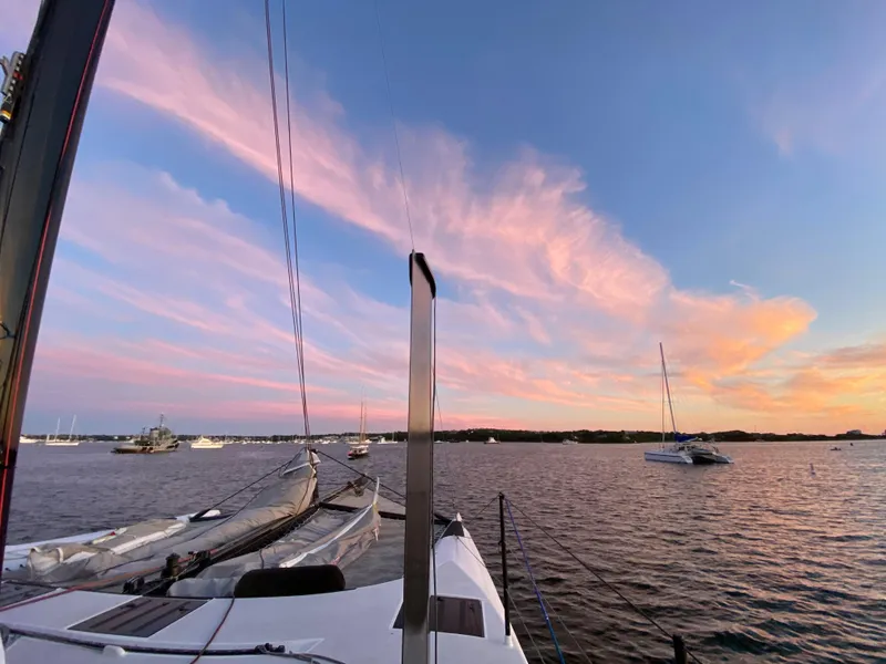 Slide: The Image of Sailing on a 2015 Gunboat 60 at sunset with vibrant pink clouds. - 15