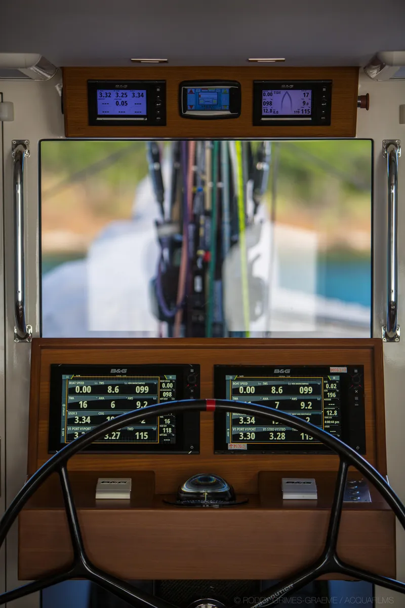 Slide: The Image of Cockpit of 2015 Gunboat 60 yacht with navigation instruments and steering wheel. - 18