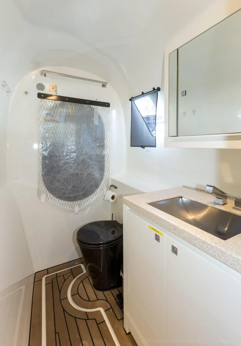 Slide: The Image of Modern bathroom in 2015 Gunboat 60 yacht with sleek fixtures and wooden flooring. - 27