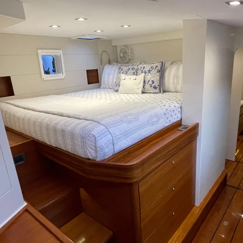 Slide: The Image of Luxurious bedroom interior of 2015 Gunboat 60 yacht with elegant bedding and wooden accents. - 29
