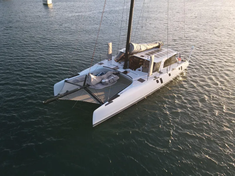Slide: The Image of 2015 Gunboat 60 catamaran sailing on calm waters. - 3