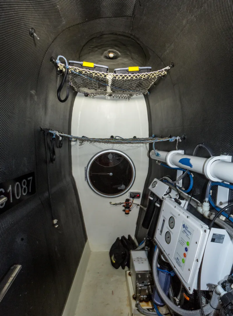 Slide: The Image of Interior of a 2015 Gunboat 60, showcasing advanced navigation equipment and storage. - 32