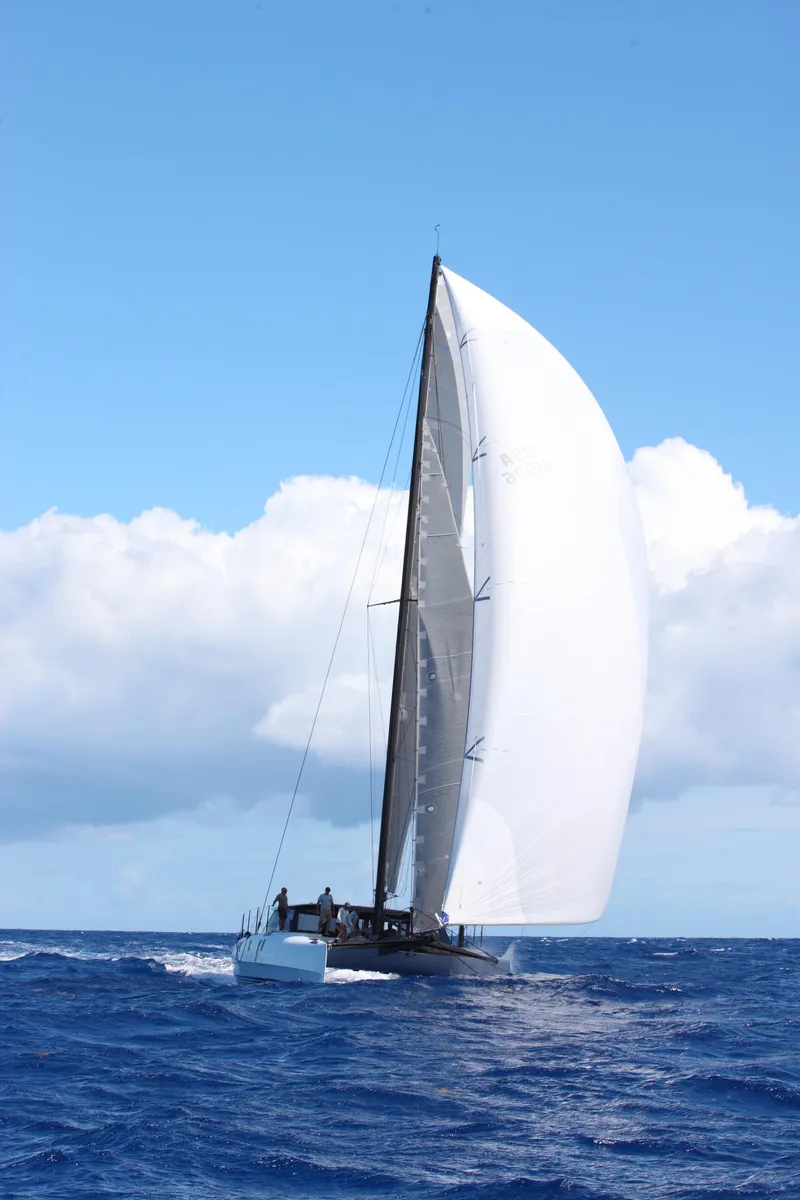 Slide: The Image of Gunboat 60 sailing on open sea under clear blue sky, 2015 model. - 9