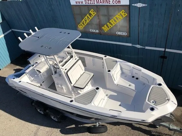 Slide: The Image of 2024 Yamaha Boats 220 FSH Sport, white, docked at Sizzle Marine, Ohio. - 4
