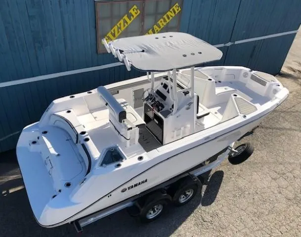 Slide: The Image of 2024 Yamaha Boats 220 FSH Sport, white, on trailer, viewed from above. - 5