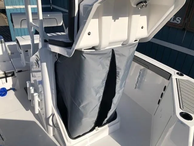 Slide: The Image of 2024 Yamaha Boats 220 FSH Sport interior with storage compartment and seating. - 9