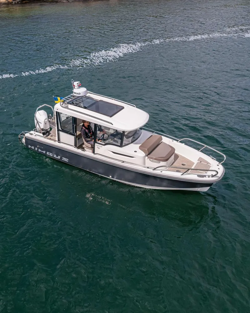 Slide: The Image of 2024 Nimbus C8 boat cruising on open water. - 2