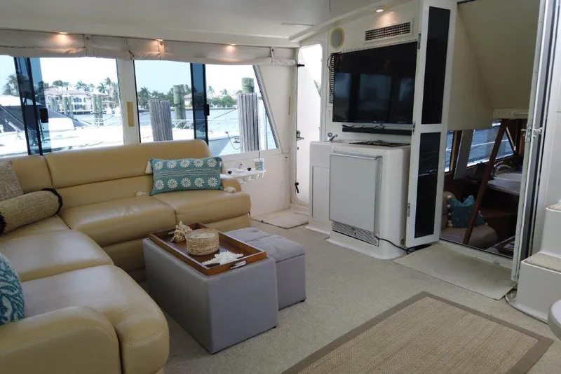 Slide: The Image of Luxurious interior of 1999 Viking Cockpit Motoryacht with leather seating and modern amenities. - 16