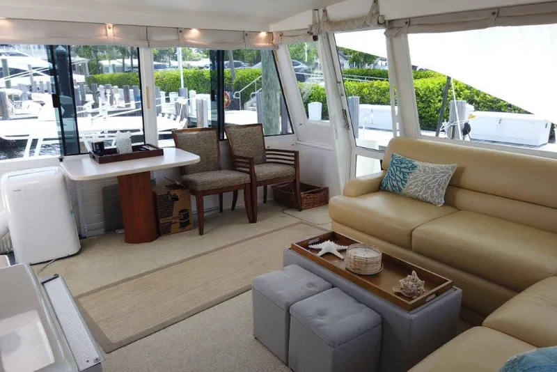 Slide: The Image of Luxurious interior of a 1999 Viking Cockpit Motoryacht with elegant seating and decor. - 17