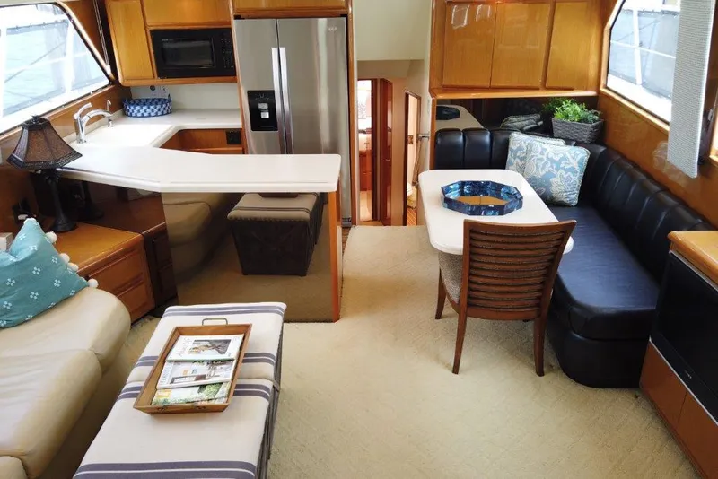 Slide: The Image of Luxurious interior of a 1999 Viking Cockpit Motoryacht with modern kitchen and cozy seating area. - 27