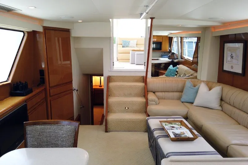 Slide: The Image of Luxurious interior of a 1999 Viking Cockpit Motoryacht with plush seating and elegant decor. - 28