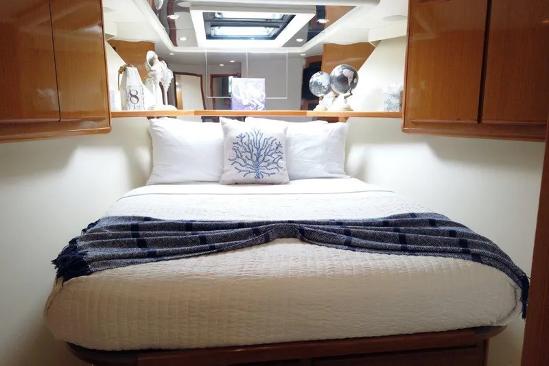 Slide: The Image of Luxurious bedroom in 1999 Viking Cockpit Motoryacht with cozy bedding and elegant decor. - 42