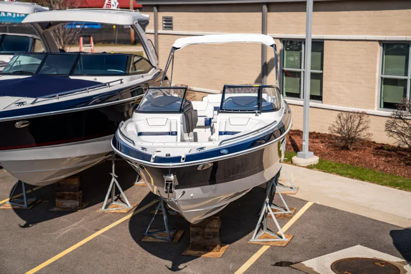 Slide: The Image of 2024 Formula 270 Bowrider boat on display in a parking lot. - 15