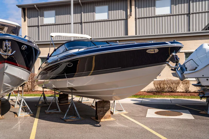 Slide: The Image of 2024 Formula 270 Bowrider boat on display in a marina. - 18