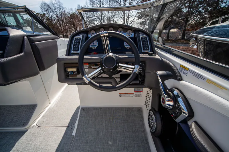 Slide: The Image of 2024 Formula 270 Bowrider cockpit with steering wheel and control panel. - 6