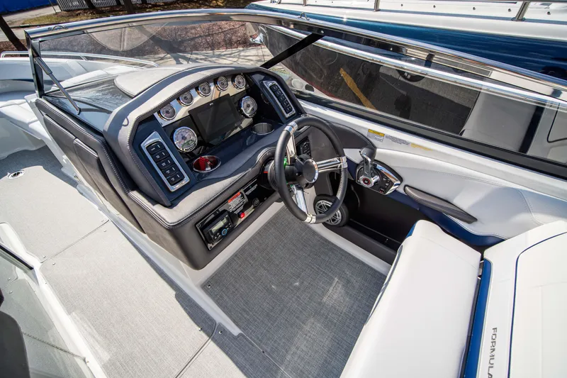 Slide: The Image of 2024 Formula 270 Bowrider cockpit with modern dashboard and steering wheel. - 7