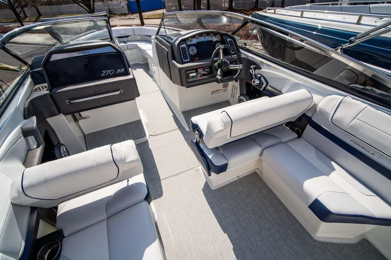 Slide: The Image of 2024 Formula 270 Bowrider interior with luxurious seating and modern dashboard. - 9