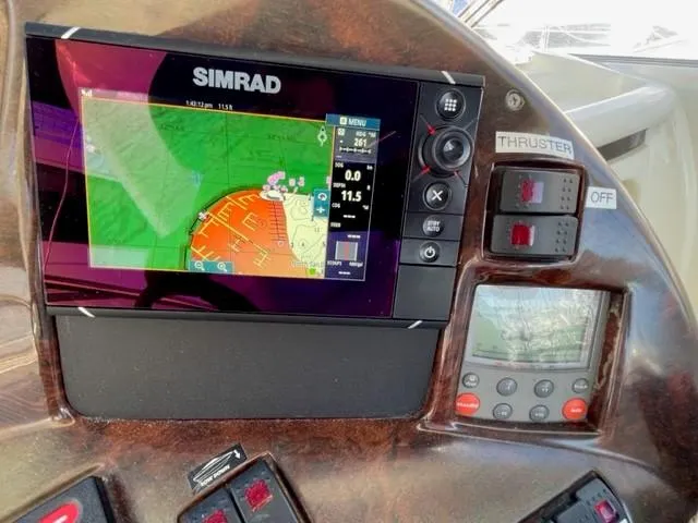 Slide: The Image of Control panel of a 2005 Cranchi 33 Express with Simrad navigation system. - 13