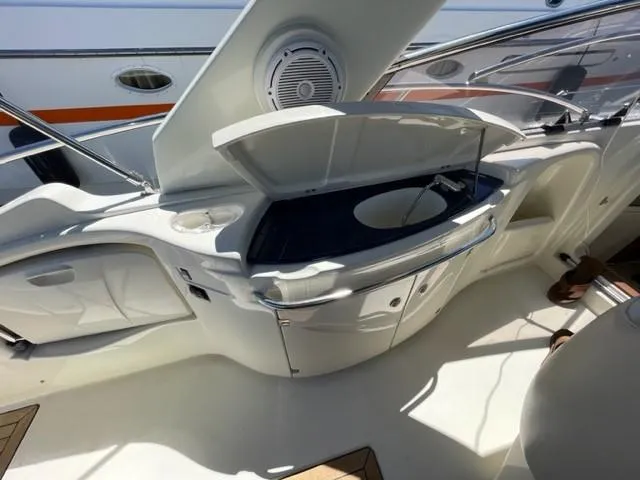 Slide: The Image of 2005 Cranchi 33 Express yacht interior with open kitchenette and sink. - 18