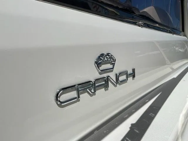 Slide: The Image of 2005 Cranchi 33 Express boat with chrome logo detail. - 20