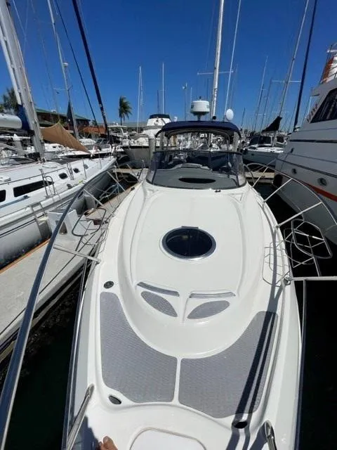 Slide: The Image of 2005 Cranchi 33 Express yacht docked among other boats in a marina. - 21
